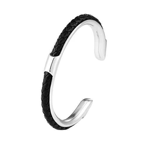 The Cuff in Silver: polished steel cuff bracelet with black braided leather inlay