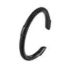 The Cuff in Black: dark steel cuff bracelet with black braided leather inlay